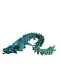 Dragón articulado impreso en 3D en filamento tornasol verde y azul, de Tecnoprint