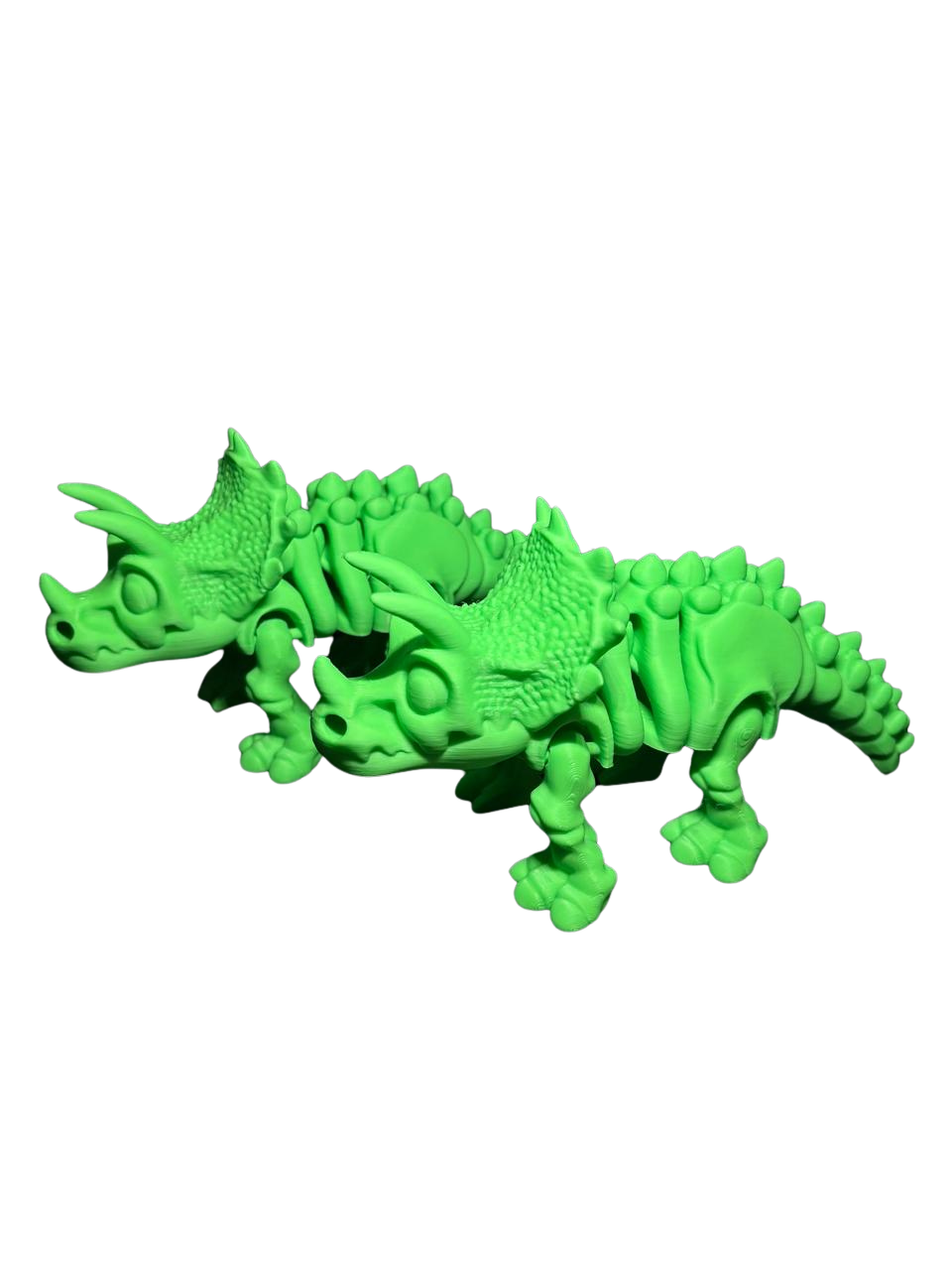 Triceratops articulado impreso en 3D en filamento verde, de Tecnoprint
